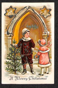 A Merry Christmas Boy and Girl With Chrismas Tree Postcard