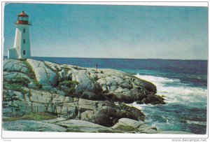 View of Lighthouse and pounding surf at this beautiful fishing Village,  Pegg...