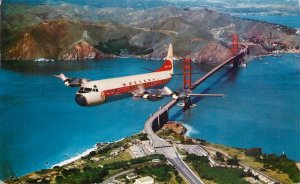 United States Western Airlines Electra plane over Golden Gate Bridge 1965