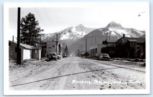 RPPC SKAGWAY, AK Alaska ~ BROADWAY STREET SCENE Post Office c1950s Cars Postcard