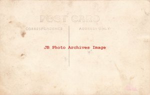 Unknown Location, RPPC, Farmer Holding a Young Holstein Bull by a Rope