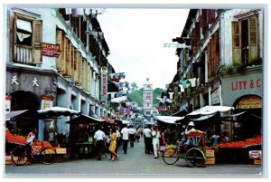 c1950's A Busy Street Scene Hock Lam Street Singapore Bicycles Postcard