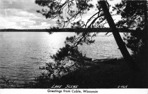 Cable Wisconsin~Lake Scene Behind Pine~Boats at Dock~1940s RPPC Postcard