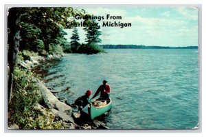 Canoe at Shore Greetings From Charlevoix Michigan MI Chrome Postcard N18
