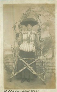 C-1910 Woman fur muff big Hat Wood Arbor studio fashion Postcard 22-4881