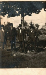 Vintage Postcard 1910's RPPC Four Men in Suits Standing by Tree Portrait Photo