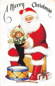 Holiday Greeting  A MERRY CHRISTMAS Red Santa & Doll  ca1910's Embossed Postcard