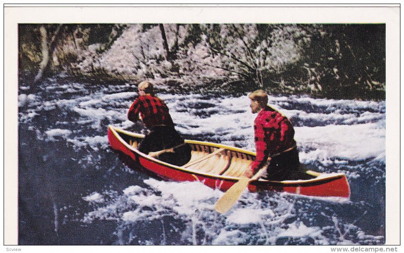 Shooting the Rapids of an Ontario River, Two Men in a Canoe, Ontario, Canada,...