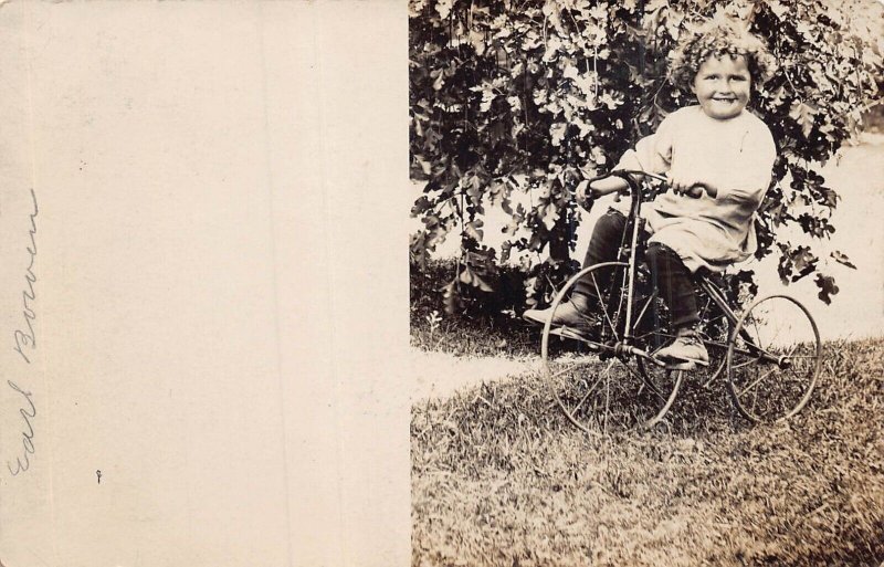 BOY RIDING TRICYCLE-IDENTIFIED EARL BROWN-JACKSON MICHIGAN~REAL PHOTO POSTCARD
