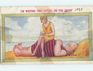 Bamforth comic BEACH GIRL SITTING ON HUSBAND'S STOMACH HL3138