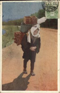 Japan Japanese Child? Carrying Heavy Load on Back c1920 Postcard USED