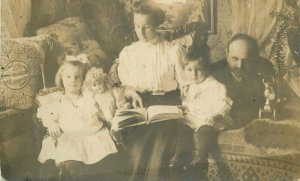 Springfield Massachusetts Family doll reading Book RPPC Photo Postcard 21-13020