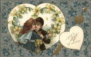 Valentine Children Kiss Flowers Hearts Embossed Winsch c1910s Postcard