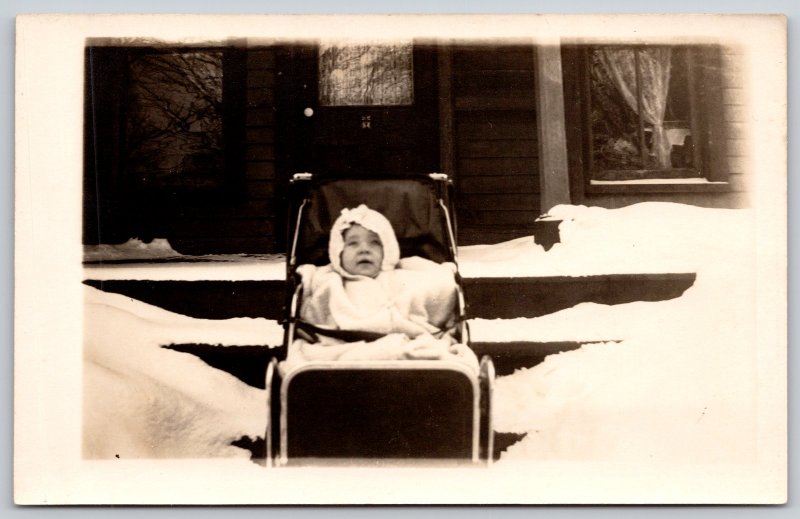 Real Photo Postcard~Bundled Up Baby in Buggy~Outside in Snow~Front Porch~c1910 