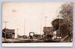 J90/ Fremont Wisconsin RPPC Postcard c1910 Bridge Street Stores 308