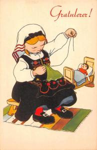 Greetings Dutch Girl with Doll Sewing Antique Postcard J71859