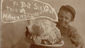 Cook NEBRASKA RPPC 1908 ADVERTISING Studio Shot MILLINERY STORE Boy Woman's Hat