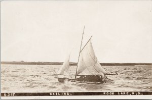 Rock Lake ND Sailing on Water Sailboat c1903 Real Photo Postcard G45