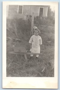 Cute Little Girl Postcard RPPC Photo At The Backyard Wheelbarrow c1910's Antique