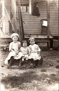 Real Photo Postcard Three Young Children Outside a House