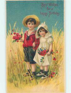 Pre-1907 GIRL AND BOY ARM IN ARM & HOLDING FLOWERS IN THE HAYFIELD HJ4102