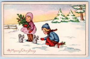 1919 CHILDREN FEED SQUIRRELS*A MERRY CHRISTMAS*WINTER SCENE*ANTIQUE POSTCARD