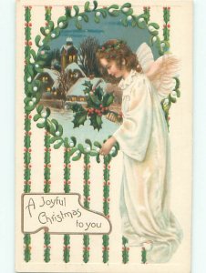 Pre-Linen Christmas BEAUTIFUL ANGEL CARRYING HOLLY BRANCH OUTSIDE TOWN AB5192
