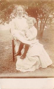 Mother holding her child Child, People Photo Writing on back 