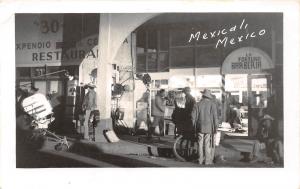 D70/ Mexicali Mexico Foreign RPPC Postcard c1950s Barberia Store People Night