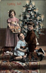 LYCKLIG JUL CHRISTMAS NETHERLANDS Children by Tree Antique Toys Treats Postcardd