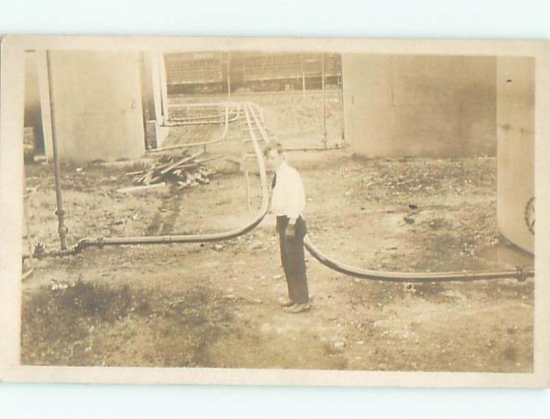 rppc Pre-1918 STANDING BESIDE MANY PIPES ATTACHED TO TANKS AC7776