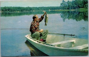 Postcard CO Ordway Greetings from - Man in rowboat catching fish