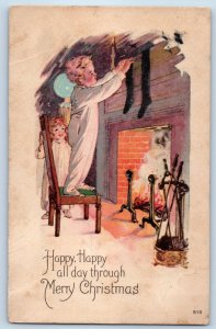 1925 Christmas Children Hanging Stockings On Fireplace Marshall MI Postcard