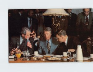 Postcard Cyrus Vance confers with Jimmy Carter and Zbigniew Brzenski, India 