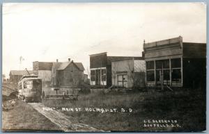 HOLMQUIST S.D MAIN STREET SCENE w/TROLLEY ANTIQUE PHOTOMONTAGE REAL PHOTO RPPC