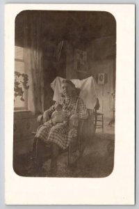 RPPC Girl with Doll Rocking Chair Interior Parlor View Postcard S30