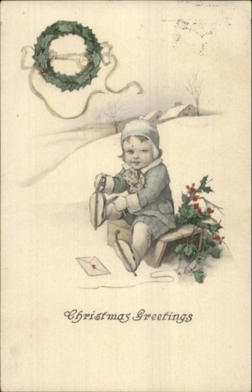 Christmas - Little Boy Lacing Up Ice Skates c1910 Postcard