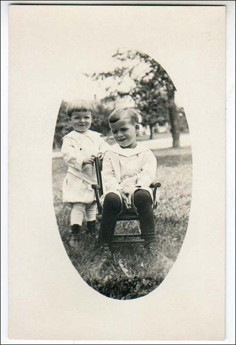 RPPC, 2 Boys,1 in a Chair ?