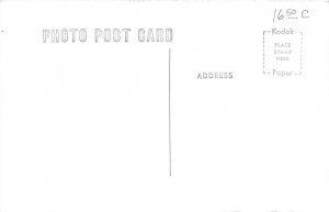 J51/ Phillipsburg Kansas RPPC Postcard c1950 Business District Stores 129