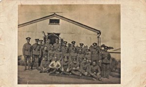 LARGE GROUP BRITISH SOLDIERS IN FRONT OF BUILDING~MILITARY REAL PHOTO POSTCARD