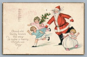 SANTA PLAYING w/ KIDS CHRISTMAS ANTIQUE POSTCARD SERIES 1035A