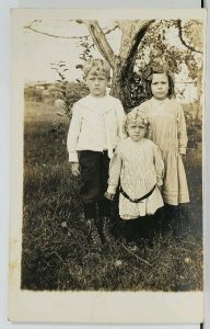 Rppc Cute Children Posing With Tree Pretty Locks of Curls Real Photo Postcard M4