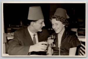 RPPC Party Scene Couple Fez Hats And Drinking He Has Eyes For Her Postcard P27