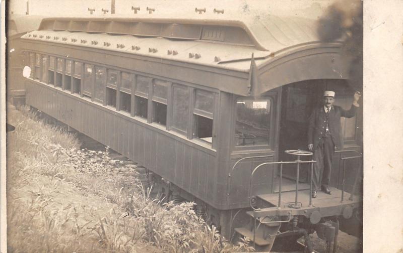 Extreme Closeup: RPPC ~Engineer Waves From Back of Long Caboose c1910 Postcard 