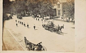 HORSE PULLED FIRE DEPARTMENT WAGON IN PARADE ON WIDE STREET-REAL PHOTO POSTCARD