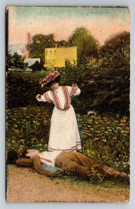 Lady Standing Over Man Laying Down Vintage Posted 1912 Postcard