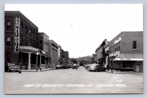 J90/ Jackson Minnesota RPPC Postcard c40-50s Main Street Stores 566