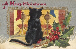 Black cat watching Christmas fire holly postcard ae100