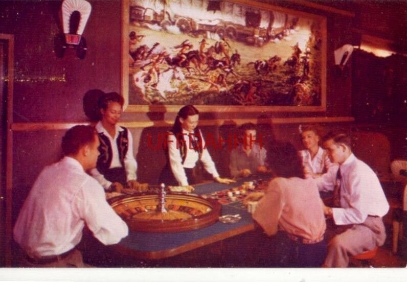 TYPICAL ROULETTE WHEEL SCENE IN THE COVERED WAGON ROOM, HAROLDS CLUB, RENO, NV