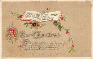 JOYOUS CHRISTMAS 1912 Embossed Postcard Open Book Holly by JOHN WINSCH